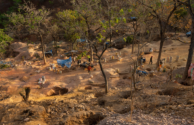 The Batambaye's main mine site is a small hill that is full of deep well-like holes reminding of an anthill.