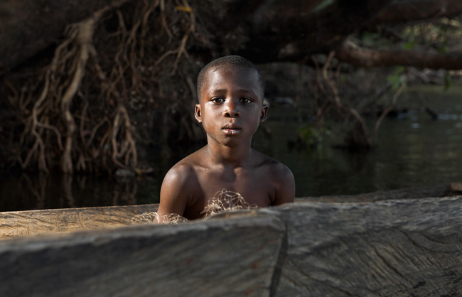 When children do not work at the mine, they help their families in daily tasks such as going fishing.