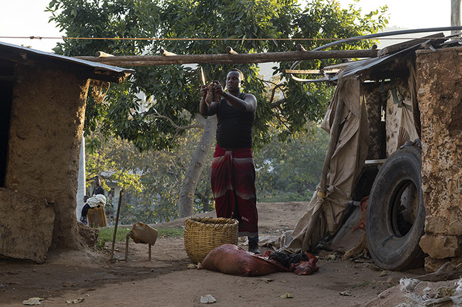 Abbas is cutting pieces of meat for the nightly meal of the hyenas. 
It's up to 200 kg of camel, sheep, and goat meat and bones that are distributed every evening to the hyenas of Harar.