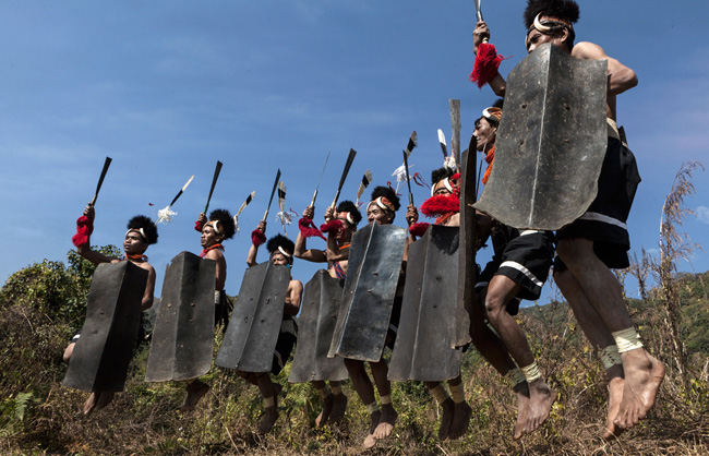 Lainong Naga warriors performing a traditional dance.