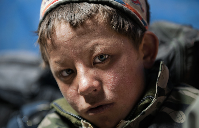 The harsh winds and the bitterly cold winter temperatures of the Pamir take a toll on the skin of Ibrahim, a 13 year old Kyrgyz nomad boy, and reveal all the time that he already spend laboring outside. Little Pamir - Afghanistan - 2016