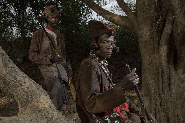 Portrait of traditional Donzo hunters in the Upper Niger National Park in Guinea. Even though they have no legal status, due to their extensive knowledge of the bush, Donzo hunters assist the Guinean government in protecting the environment and combating poaching.